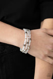 Here to the Staycation White Bracelet-Jewelry-Paparazzi Accessories-Ericka C Wise, $5 Jewelry Paparazzi accessories jewelry ericka champion wise elite consultant life of the party fashion fix lead and nickel free florida palm bay melbourne
